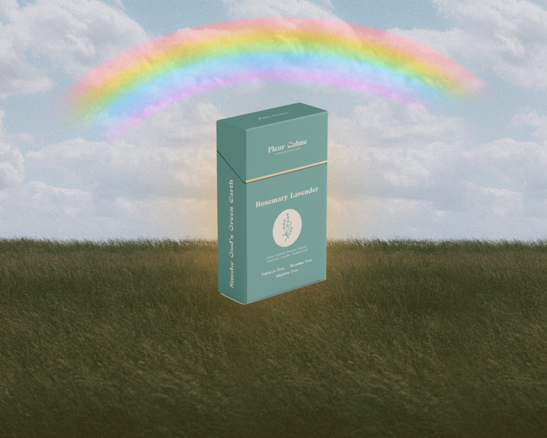 Fleur Calme herbal cigarette box on grass field with rainbow in sky.