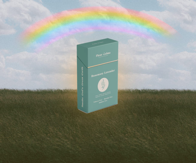 Fleur Calme herbal cigarette box on grass field with rainbow in sky.